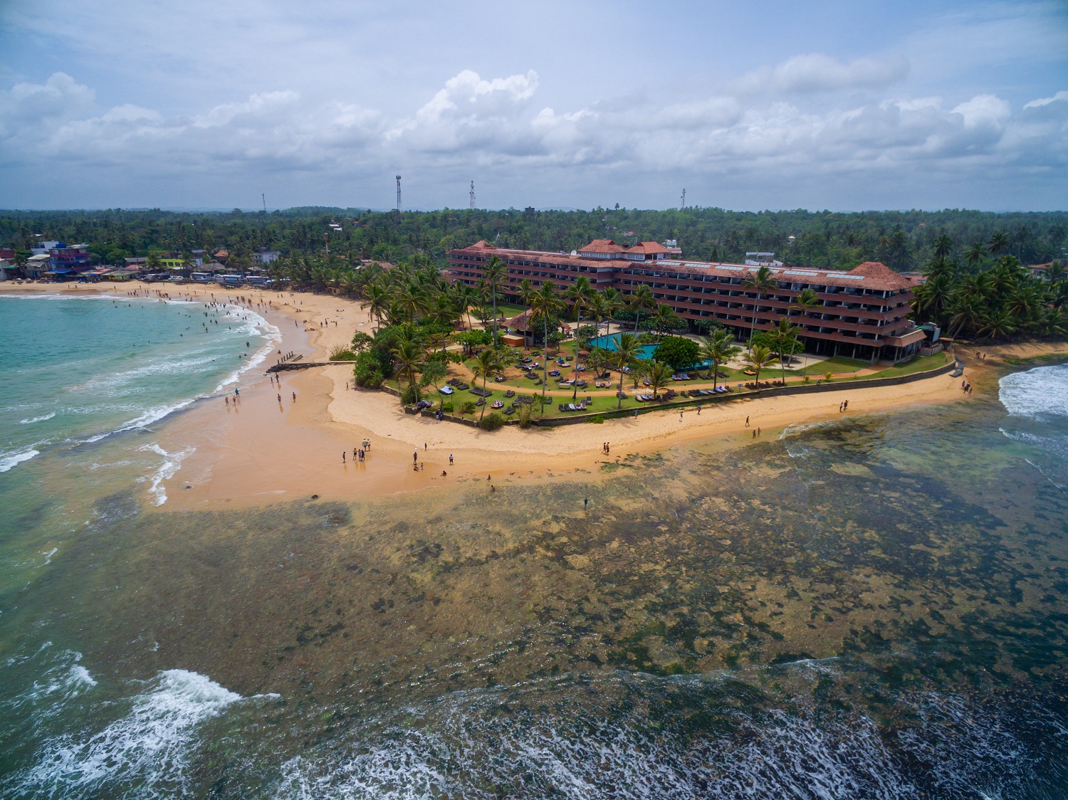 An aerial shot of a tropical beach in Sri Lanka perfect for a family vacation